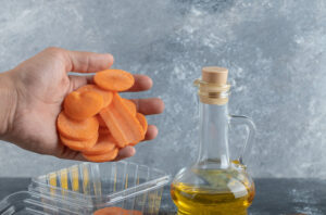 Carrot and oil in pot