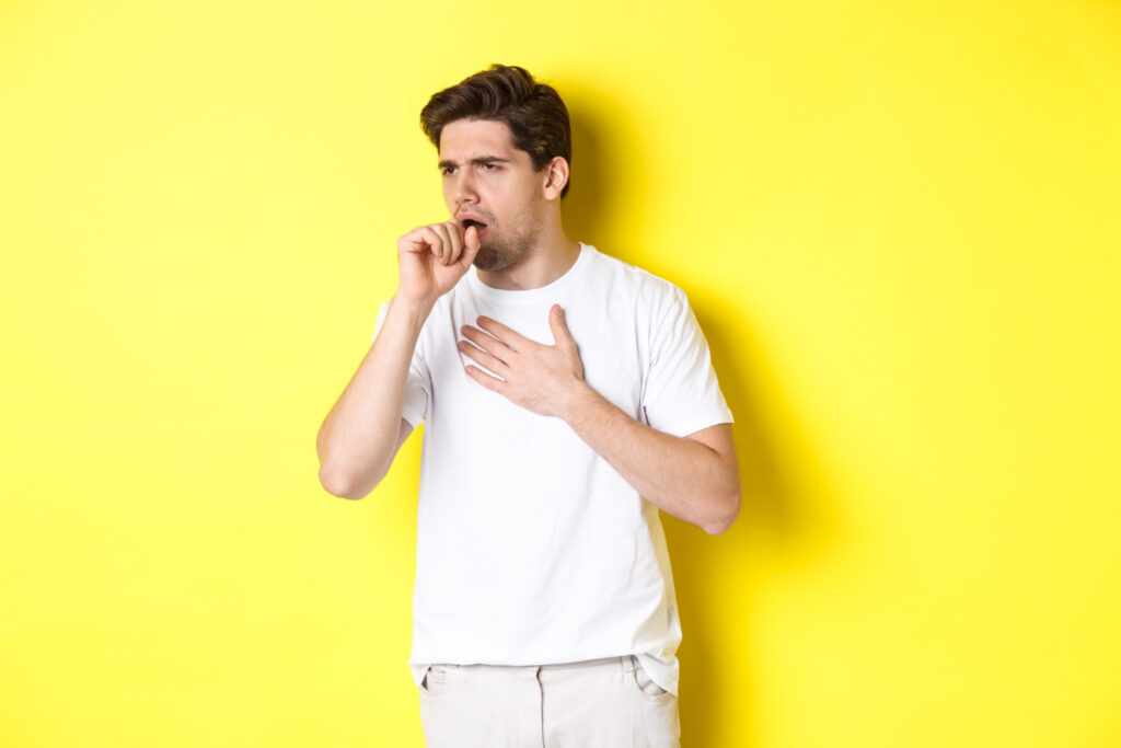 a man is coughing