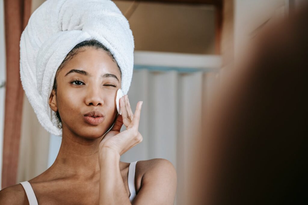 girl is cleaning face