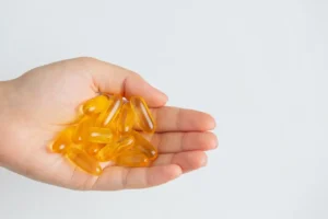 vitamin d capsules in the hand