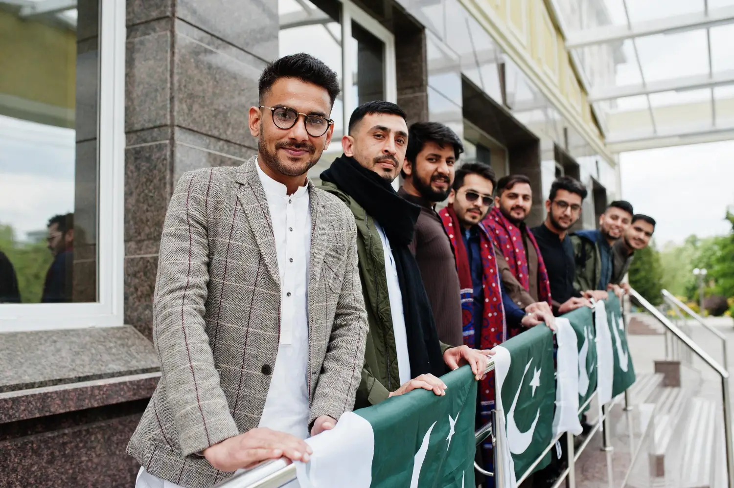 a group of young doctors are standing in the balcony on independence day