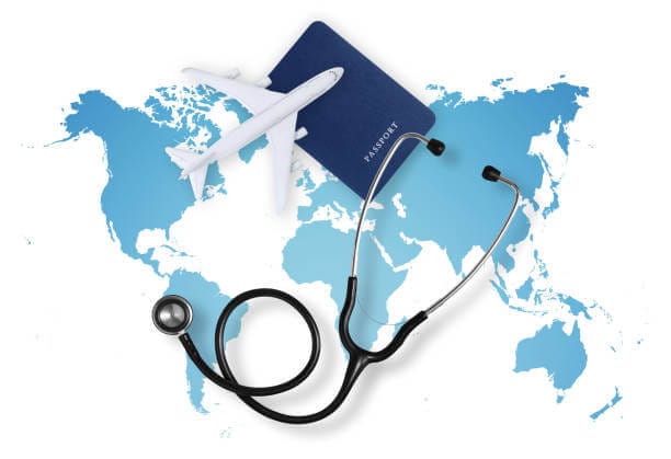 a steth and passport on a map for mbbs abroad