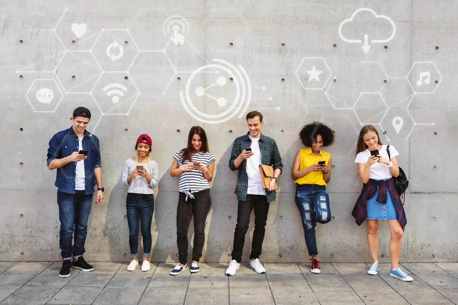 A diverse group of young adults standing together, engaged in social media on their smartphones, symbolizing the importance of social connections in the digital age.