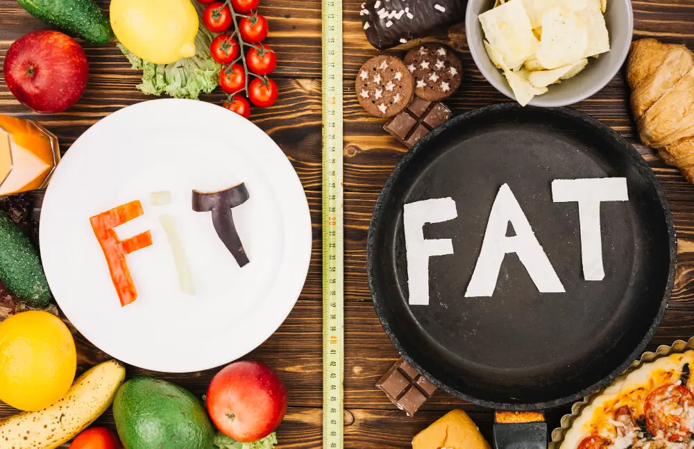 A visual comparison showing “Fit” written on a healthy plate with fruits and vegetables and “Fat” written on a pan with junk food, representing the role of metabolic factors in weight and skin health.