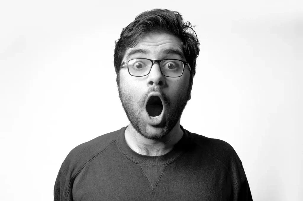 Man with open mouth while breathing — concept of mouth breathing at night, a common sleep issue linked to snoring and nasal congestion